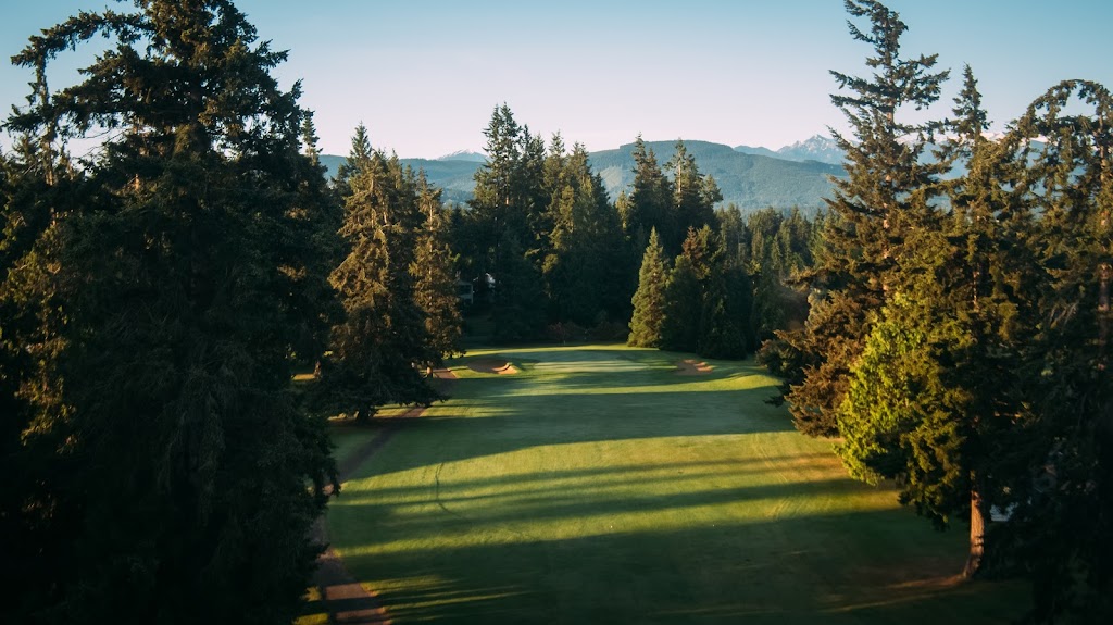 Panoramic view of a lush green golf course at Sunland Golf Club. Smooth