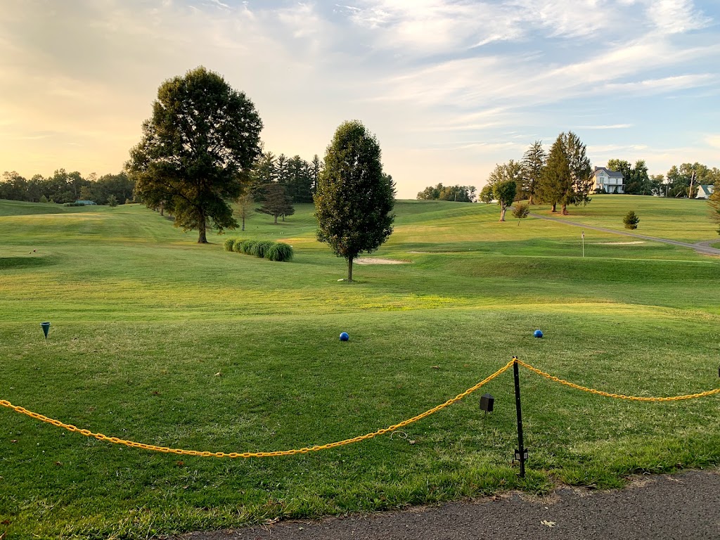 Panoramic view of a lush green golf course at Sunny Croft Country Club. Smooth