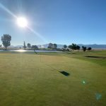 Panoramic view of a lush green golf course at Sunset View Golf Course. Smooth