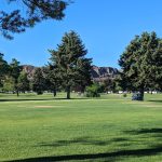 Panoramic view of a lush green golf course at Suntides Golf Course. Smooth