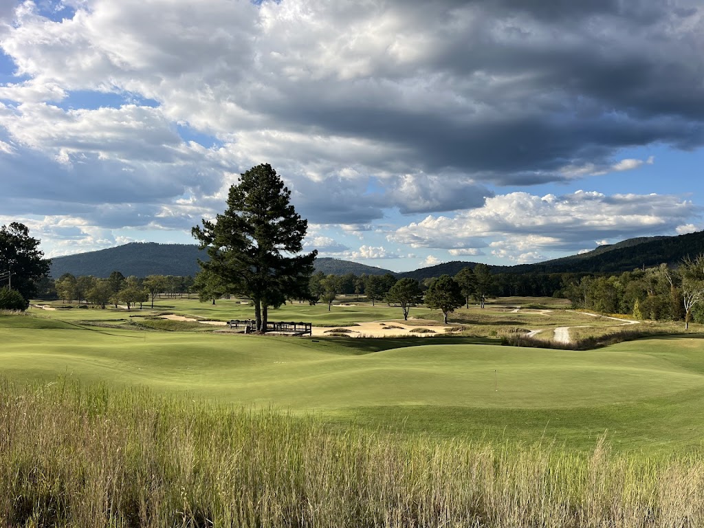 Panoramic view of a lush green golf course at Sweetens Cove Golf Club. Smooth