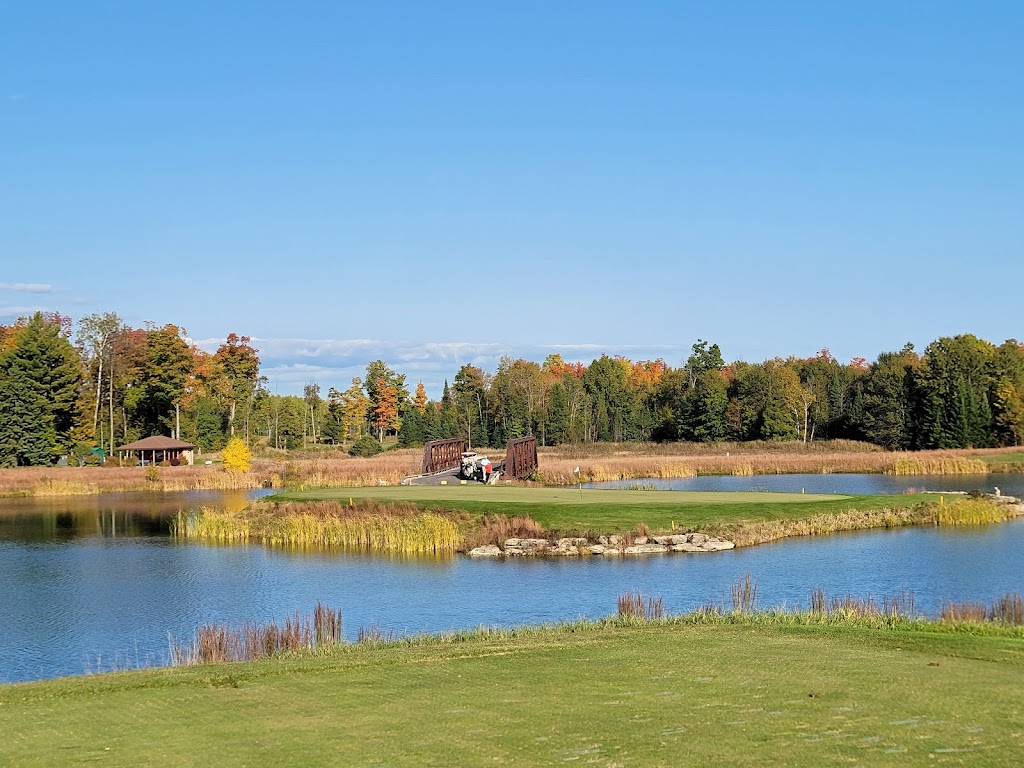 Panoramic view of a lush green golf course at Sweetgrass Golf Club. Smooth