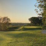 Panoramic view of a lush green golf course at Swope Memorial Golf Course. Smooth
