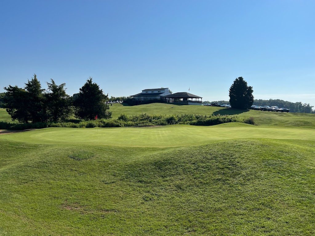 Panoramic view of a lush green golf course at Sycamore Creek Golf Course. Smooth
