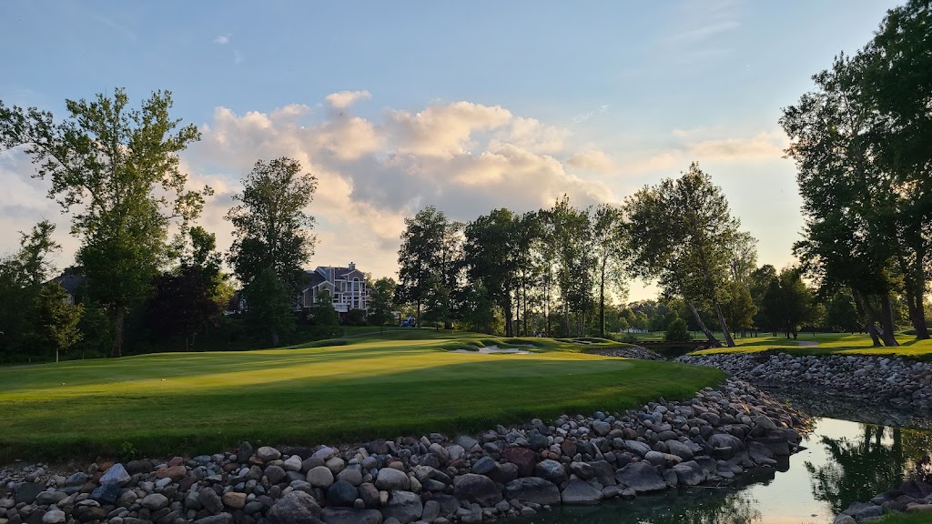 Panoramic view of a lush green golf course at Sycamore Hills Golf Club. Smooth
