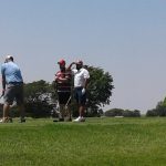 green grass with the flag in the hole.