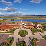 Panoramic view of a lush green golf course at TPC Colorado. Smooth