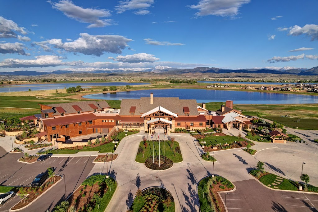 Panoramic view of a lush green golf course at TPC Colorado. Smooth