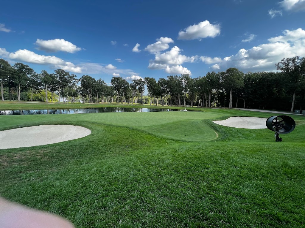 Panoramic view of a lush green golf course at TPC Deere Run. Smooth