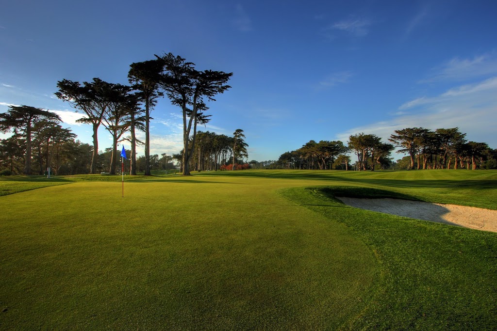 Panoramic view of a lush green golf course at TPC Harding Park. Smooth