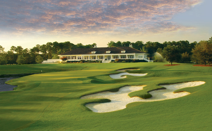 Panoramic view of a lush green golf course at TPC Myrtle Beach. Smooth