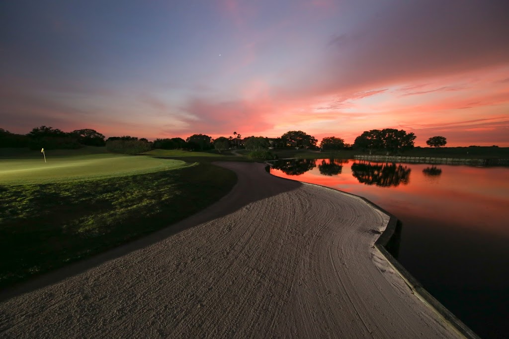 Panoramic view of a lush green golf course at TPC Prestancia. Smooth