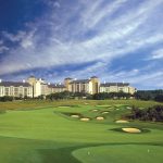 Panoramic view of a lush green golf course at TPC San Antonio. Smooth