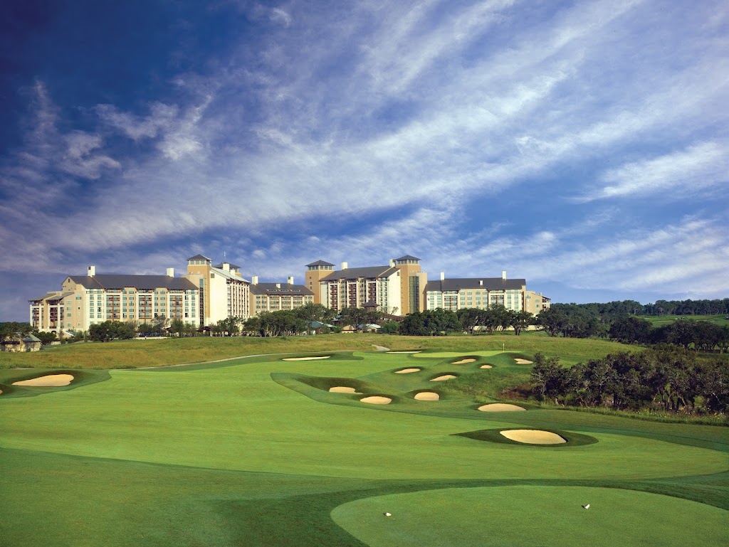 Panoramic view of a lush green golf course at TPC San Antonio. Smooth