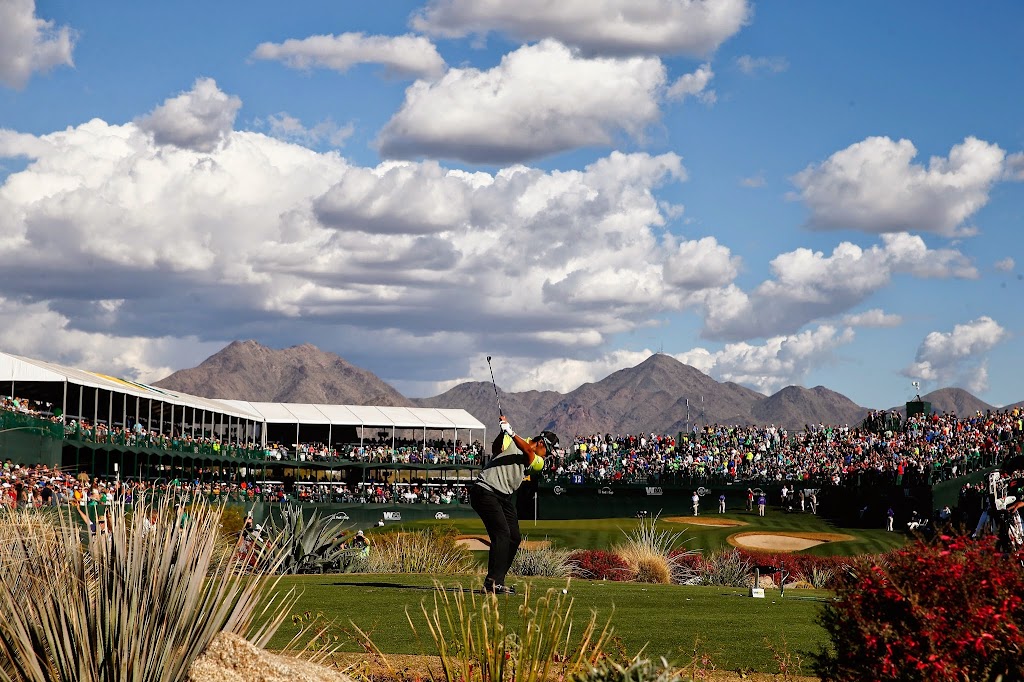 Panoramic view of a lush green golf course at TPC Scottsdale. Smooth