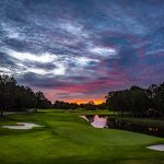 Panoramic view of a lush green golf course at TPC Southwind. Smooth