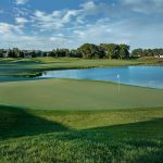 green grass with the flag in the hole.