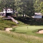 green grass with the flag in the hole.