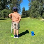green grass with the flag in the hole.
