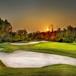 Panoramic view of a lush green golf course at Talamore Golf Resort. Smooth