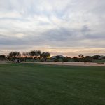 green grass with the flag in the hole.