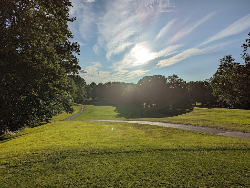 Panoramic view of a lush green golf course at Tallwood Country Club LLC. Smooth