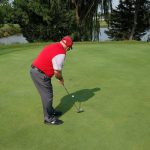green grass with the flag in the hole.