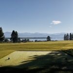 Panoramic view of a lush green golf course at Tamarack Resort Golf Course. Smooth