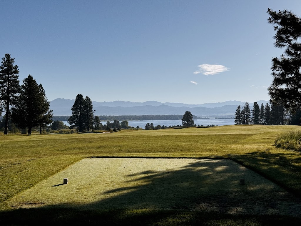 Panoramic view of a lush green golf course at Tamarack Resort Golf Course. Smooth