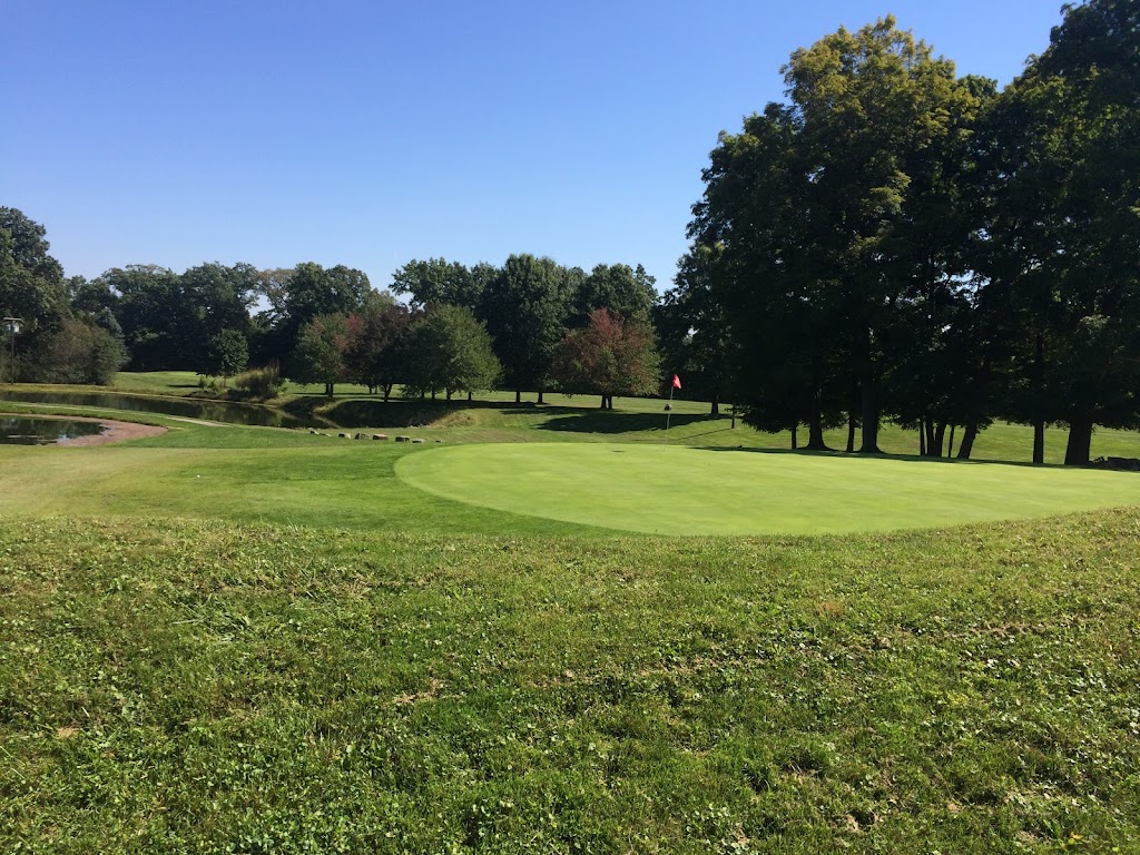 Panoramic view of a lush green golf course at Tanglewood Public Golf Course & Driving Range. Smooth