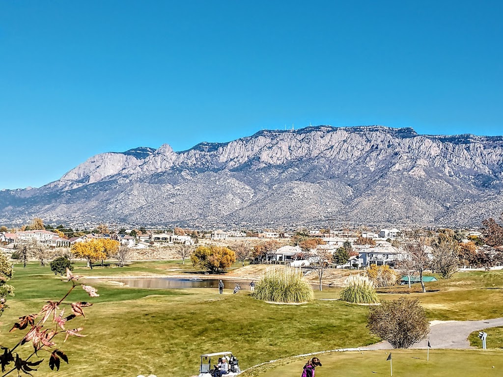 Panoramic view of a lush green golf course at Tanoan Country Club. Smooth