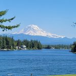 Panoramic view of a lush green golf course at Tapps Island Golf Course. Smooth