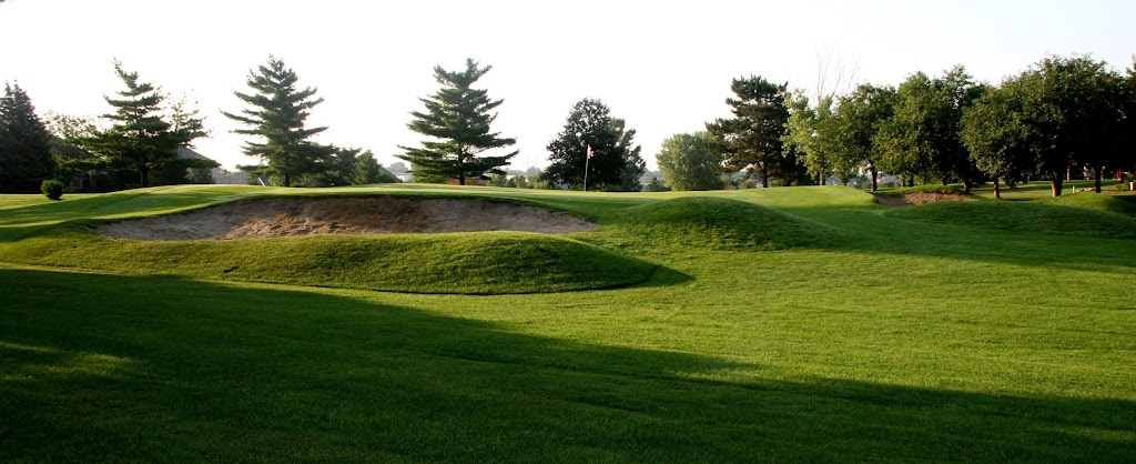 Panoramic view of a lush green golf course at Tara Hills Golf Course. Smooth