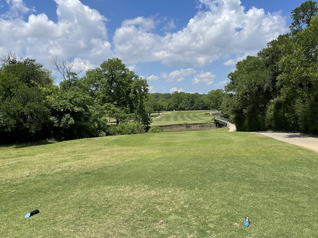 Panoramic view of a lush green golf course at Tenison Park Golf Course. Smooth