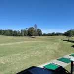 Panoramic view of a lush green golf course at Tennessee Hills Golf Course. Smooth