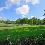 Panoramic view of a lush green golf course at Tennessee Mountain Golf. Smooth