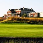 Panoramic view of a lush green golf course at Terradyne Country Club. Smooth