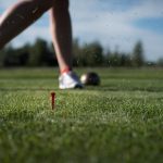 green grass with the flag in the hole.