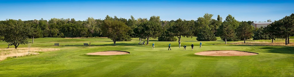 Panoramic view of a lush green golf course at Tex Consolver Golf Course. Smooth
