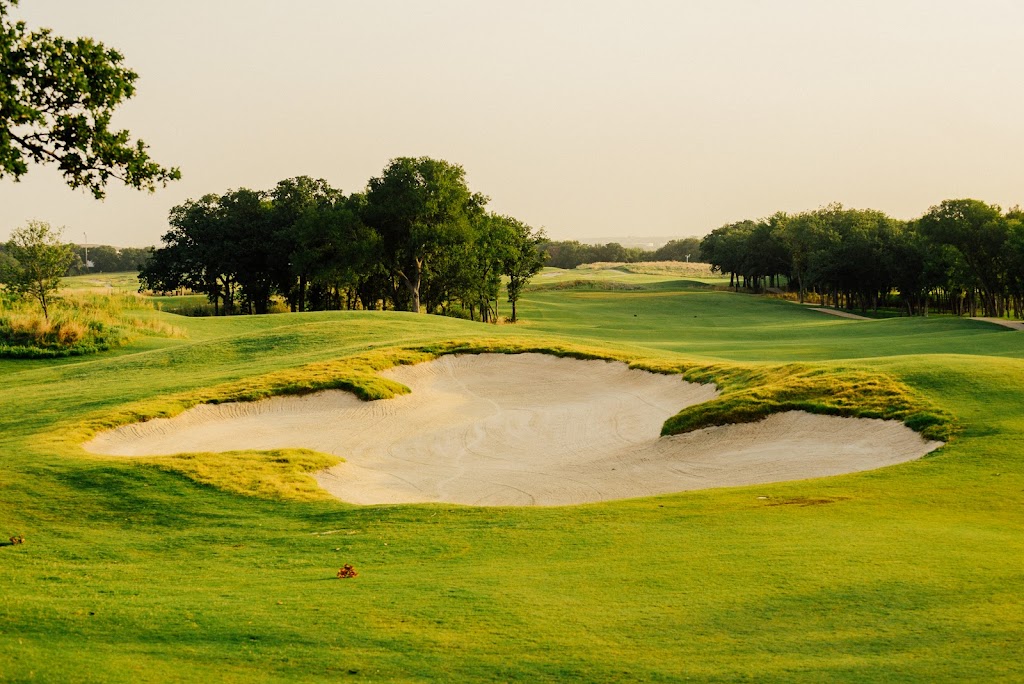 Panoramic view of a lush green golf course at Texas Rangers Golf Club. Smooth