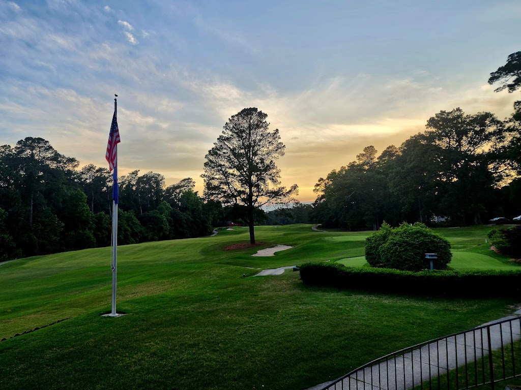 Panoramic view of a lush green golf course at The Aiken Golf Club. Smooth