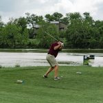 green grass with the flag in the hole.