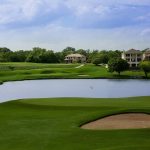 Panoramic view of a lush green golf course at The Bandit Golf Club. Smooth