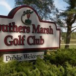 Panoramic view of a lush green golf course at The Barn at Southers Marsh Golf Club. Smooth