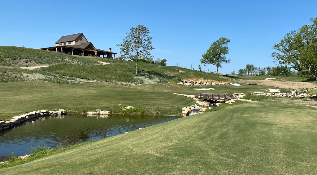 Panoramic view of a lush green golf course at The Battlefield Par 3 Course at Shangri-La. Smooth
