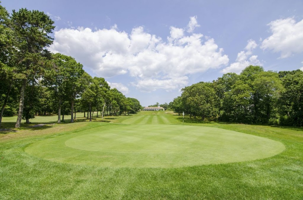 Panoramic view of a lush green golf course at The Bay Pointe Club. Smooth