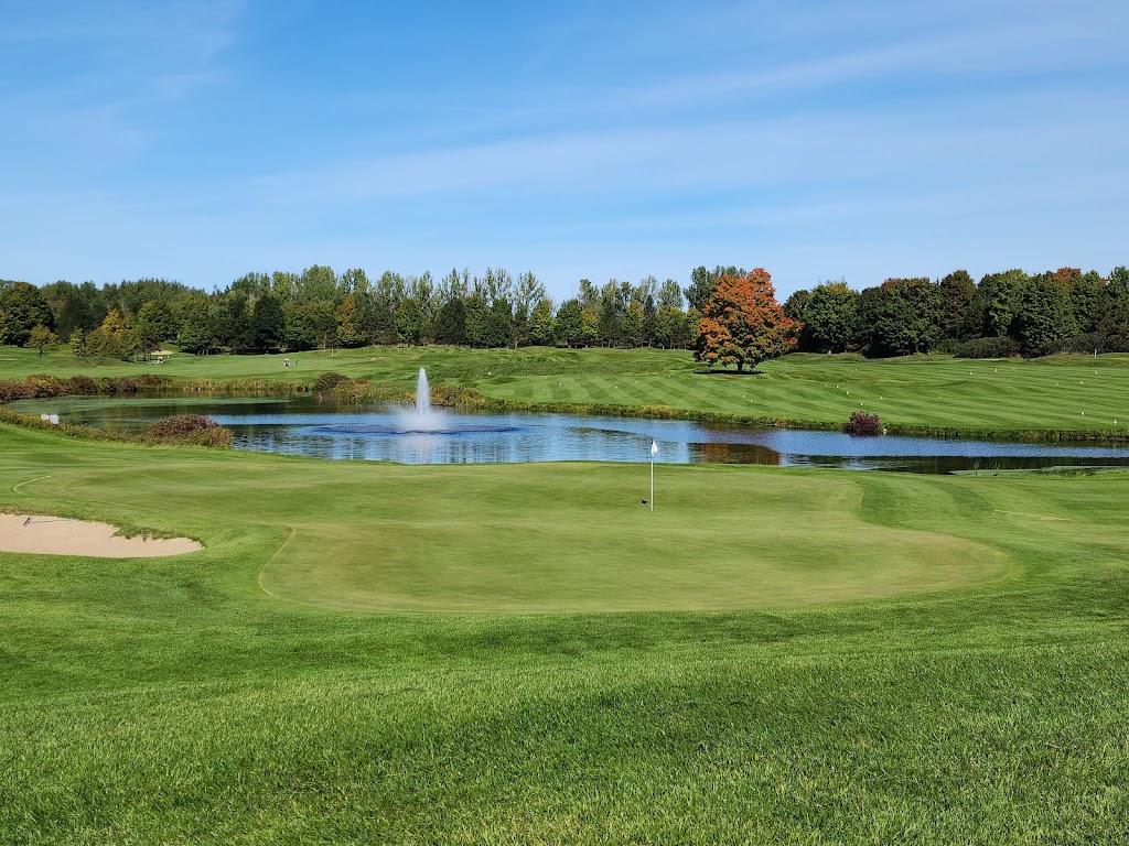 Panoramic view of a lush green golf course at The Bear Golf Course. Smooth