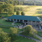 Panoramic view of a lush green golf course at The Bridges Golf Course of Henderson. Smooth