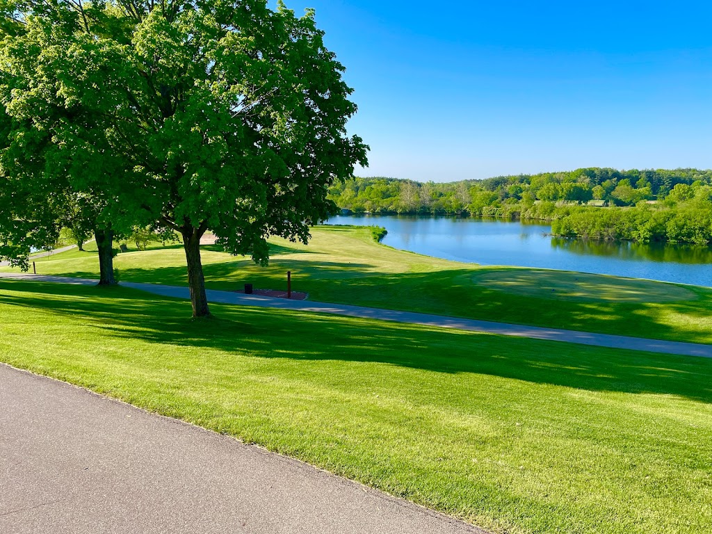 Panoramic view of a lush green golf course at The Brute Golf Course at Grand Geneva. Smooth