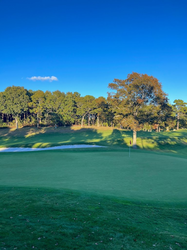 Panoramic view of a lush green golf course at The Cape Club. Smooth